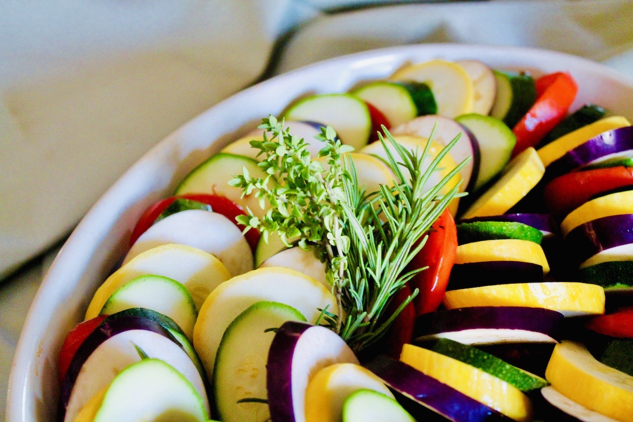 assemble by layering vegetables over the ground beef mixture