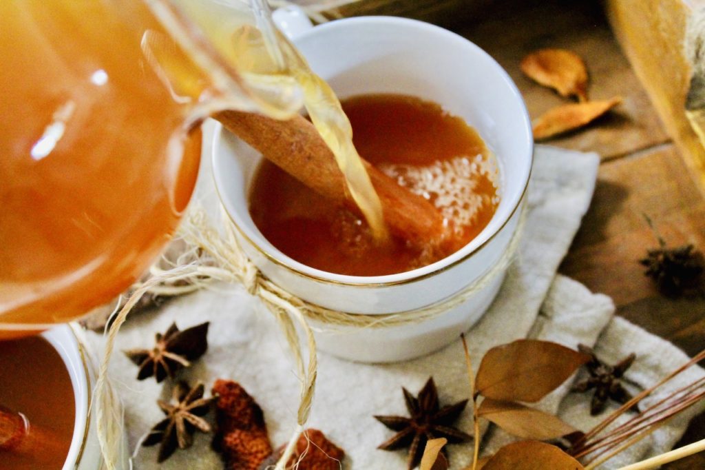 pour rum spiced tea into a cozy mug