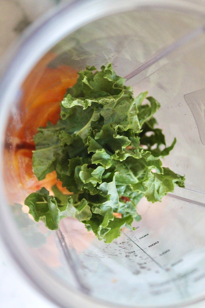 blend kale with peach chunks in blender
