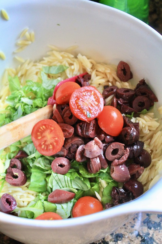 mix up orzo salad with kalamata, feta, tomato