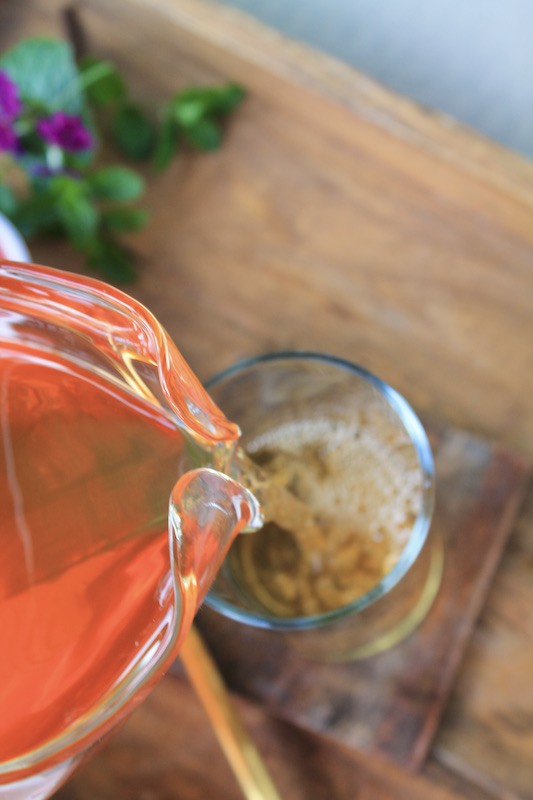 pouring fresh brewed sun tea