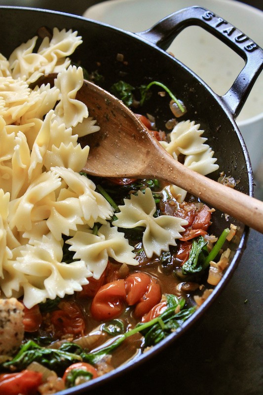 stir bow tie pasta into the skillet with the cooked chicken breast