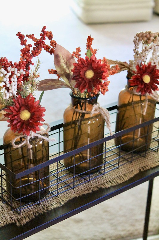 brown glass bottle flowers