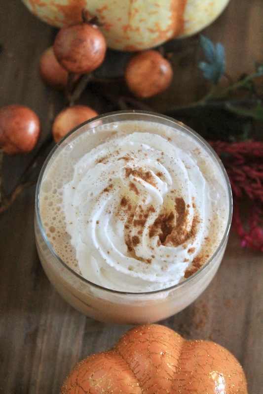 garnish the coffee and bourbon thanksgiving egg nog creamy cocktail with whipped cream and cinnamon