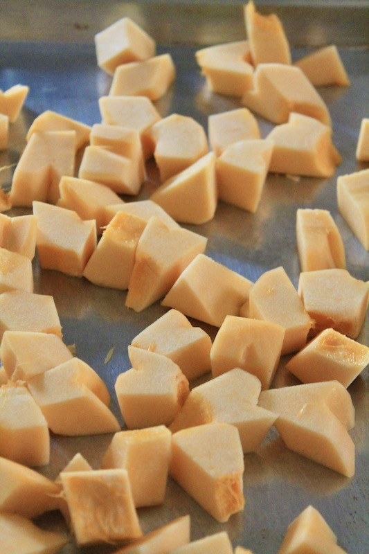 acorn squash for roasting on a sheet pan