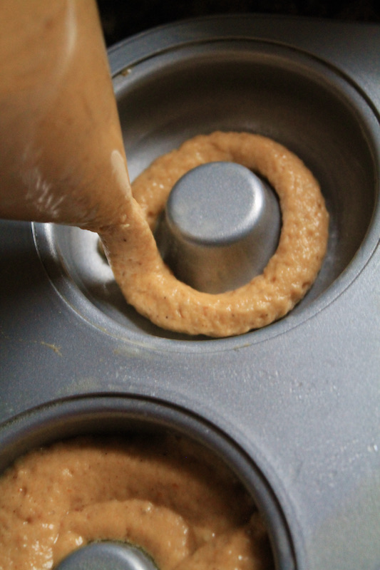 pipe donut batter into donut pan