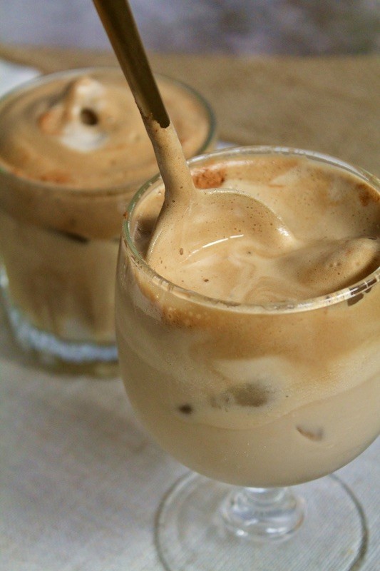 tipsy iced coffee with foam and rum