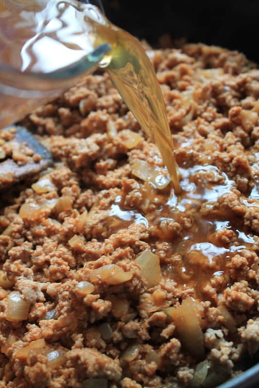 prepare ground turkey on the stovetop with stock, white wine, and spices