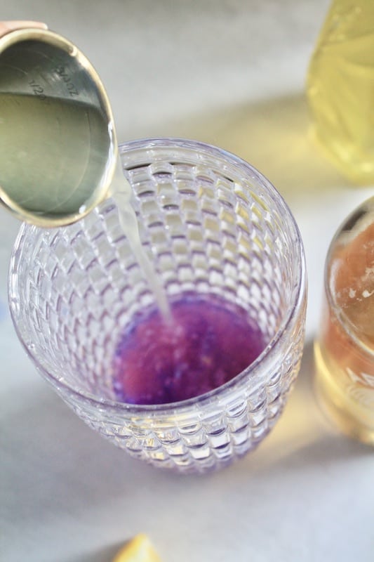 combine lemon juice and empress gin in cocktail shaker