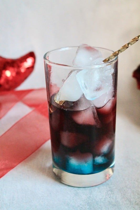 red wine tequila cocktail with blue curacao