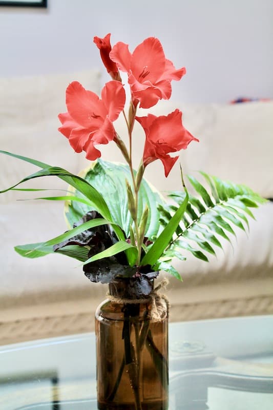 brown glass bottle flower vase arrangement