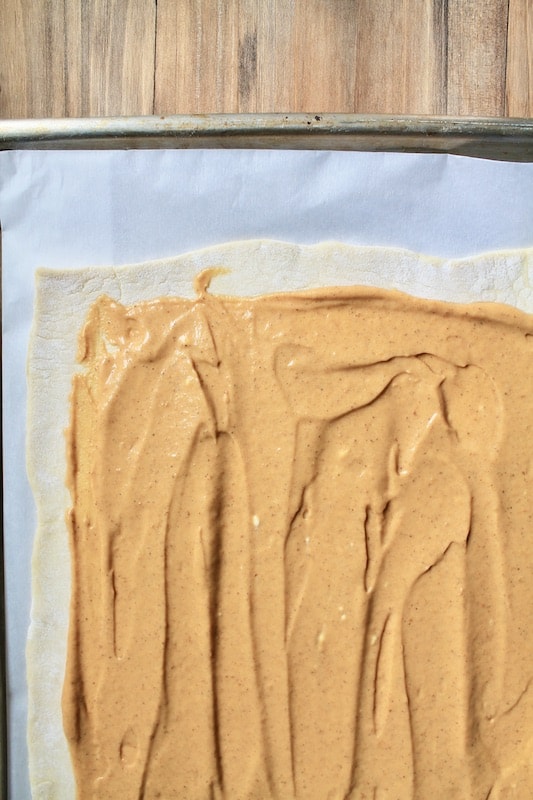spread pumpkin mascarpone pumpkin on puff pastry sheet