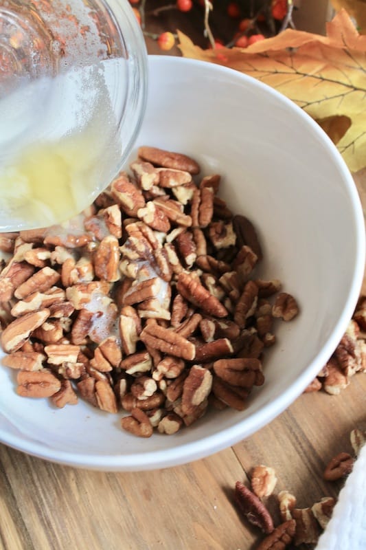combine pecans with butter and maple syrup