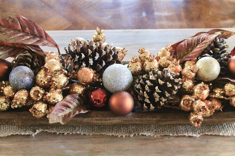 easy dough bowl centerpiece for christmas with gold berries, pine cones and ornaments