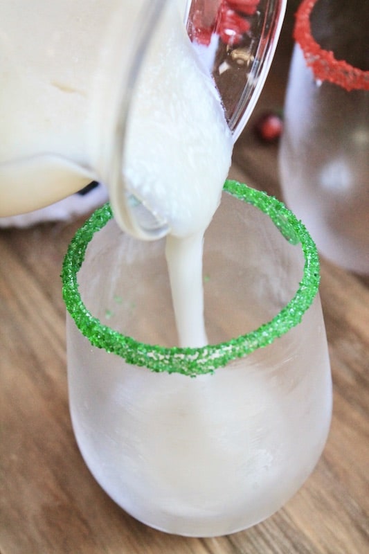 pour into a glass rimmed with red and green sugars