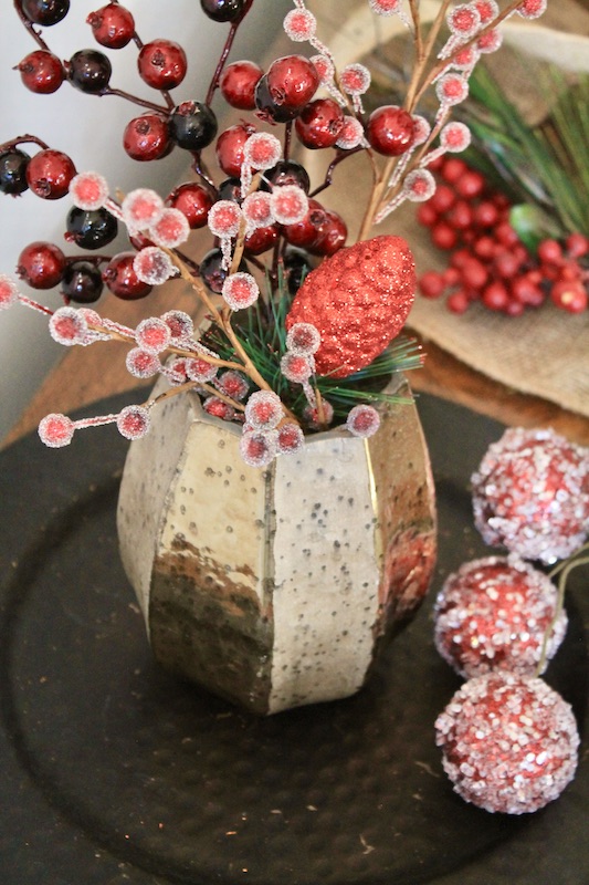 gold vase with winter berries floral arrangement christmas centerpiece idea