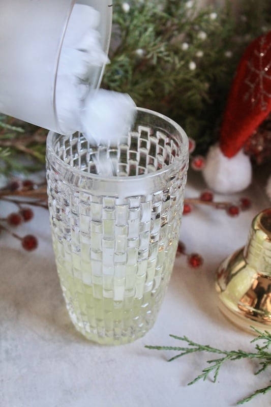 mix vodka and other ingredients in a cocktail shaker with ice and shake