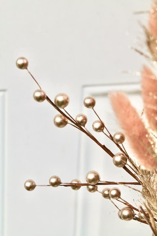 golden winter berries in a new years eve vase centerpiece
