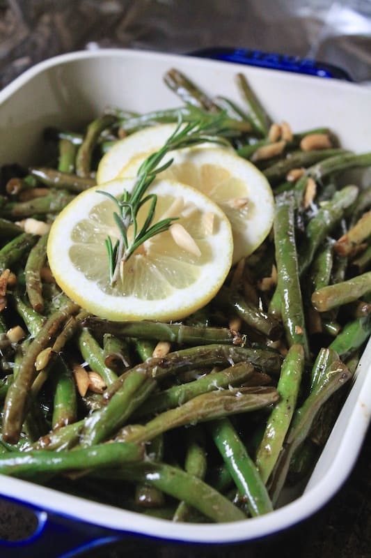 top zesty sauteed green beans with lemon and garlic with parmesan cheese if desired. Serve warm