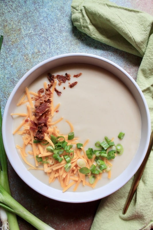 serve hot with cheddar cheese, bacon bits, and scallions 