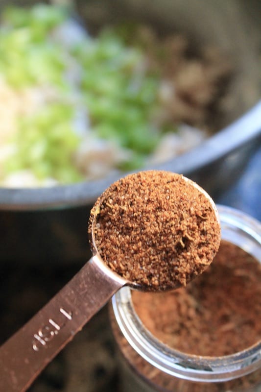 combine canned chicken chunks with cajun seasoning 