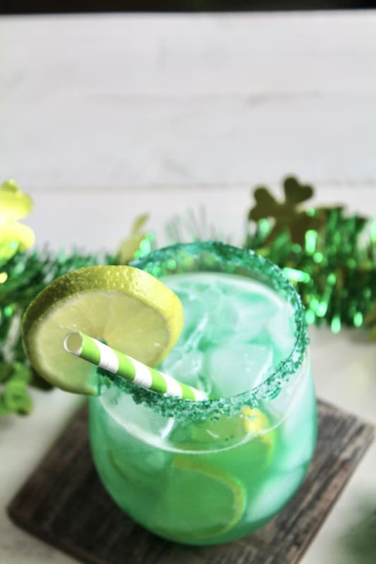 add blue curaçao, green apple liqueur, lime juice, and simple syrup and honey crisp apple juice