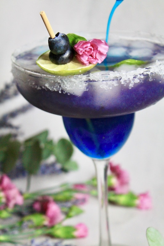 strain into margarita glass over fresh ice and float more blue curaçao over the top of your margarita for more color if desired