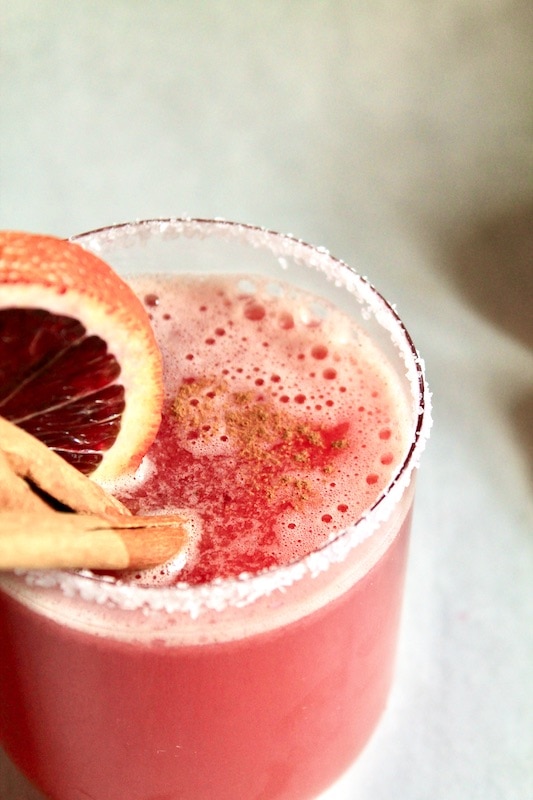 strain and dust with cinnamon. garnish with cinnamon stick and blood orange or apple