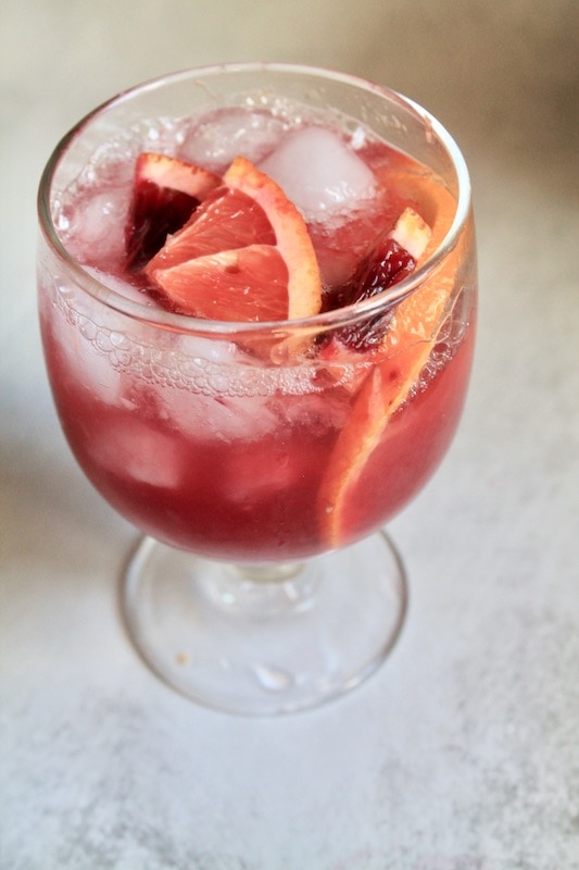 splash in fresh blood orange juice and shake ingredients together