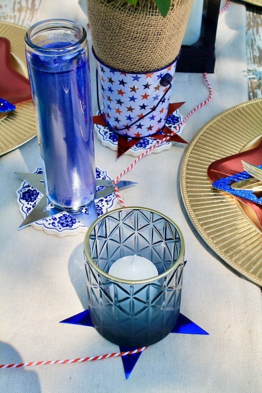 put down a runner and dot the table with mismatched candles in blue