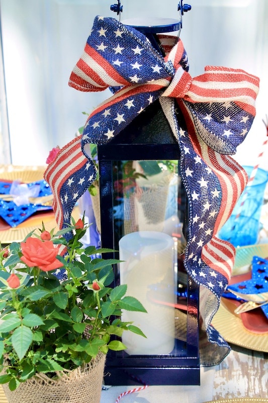 use a lantern as a 4th of july table centerpiece