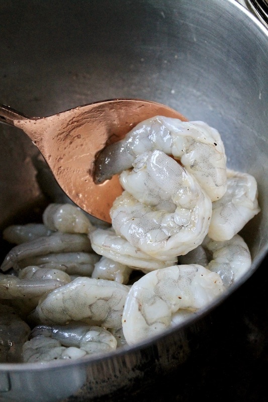 toss shrimp together with Worcestershire sauce olive oil salt pepper