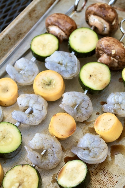skewer the vegetables and shrimp