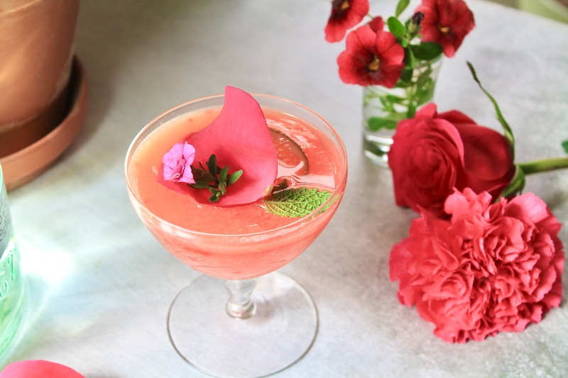 add lime juice and simple syrup to the cocktail shaker with muddled strawberries
