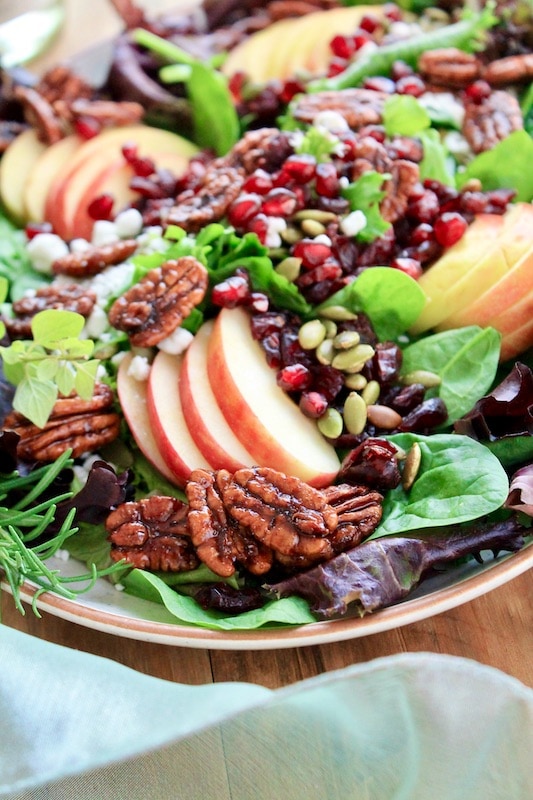 arrange spring mix plus spinach greens over the serving platter
