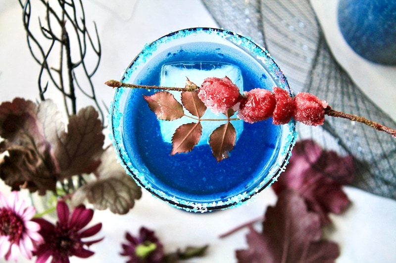 gather light rum, lemon,  apple cranberry juice simple syrup prosecco and blue curacao