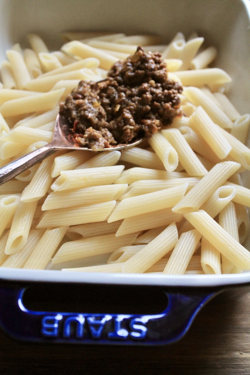 spread leftover taco meat over half cooked pasta