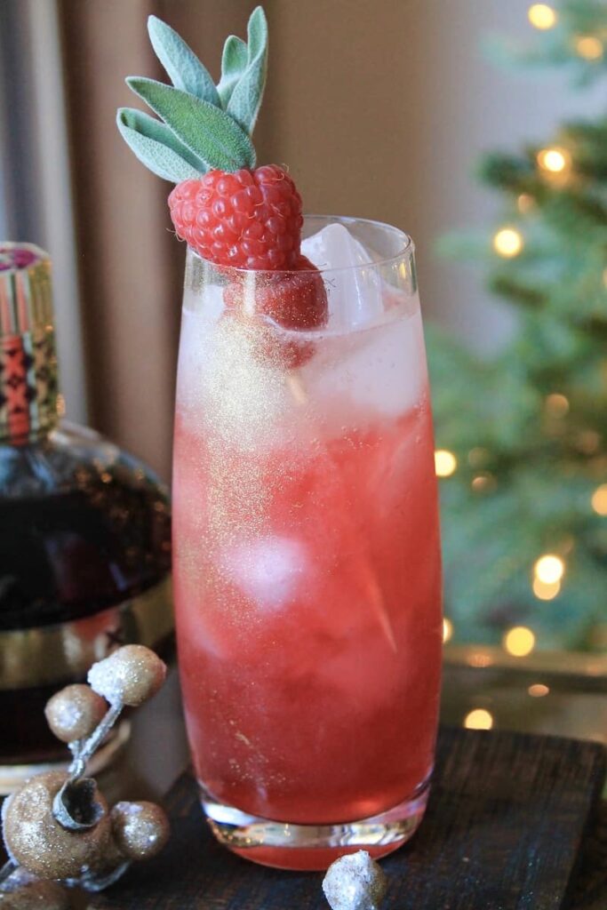 festive raspberry sage cocktail with gin and chambord