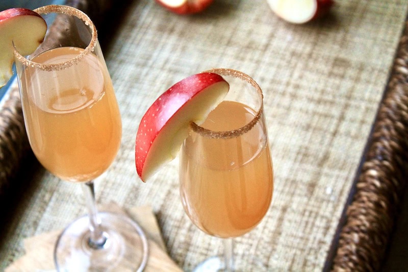 make a cinnamon sugar rim with white sugar and cinnamon, then dip glasses in after swiping with lemon