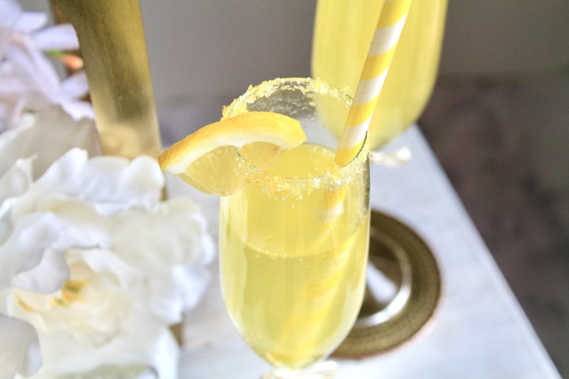 to each champagne glass splash in some of the lemon juice mixture and top off with vodka