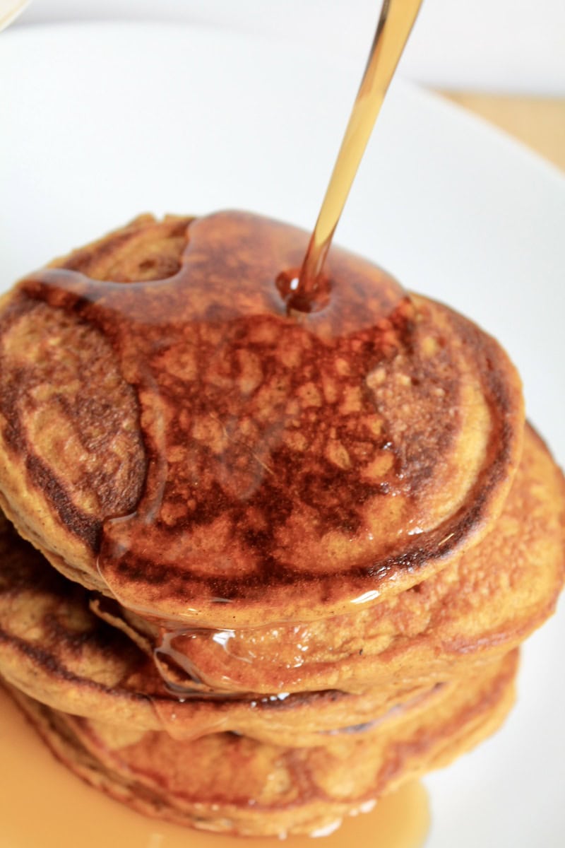 serve easy pumpkin pancakes with maple syrup pr whipped cream