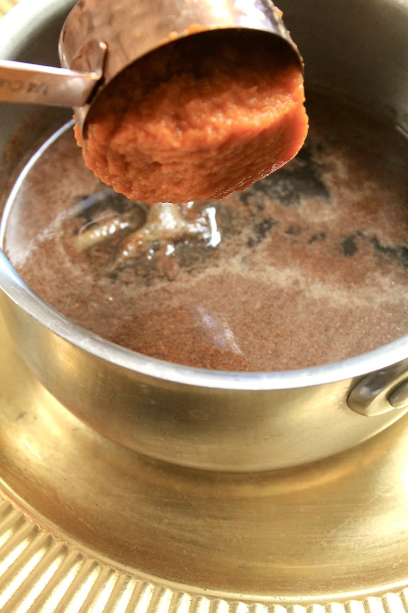 simmering pumpkin spice syrup in a small sauce pan