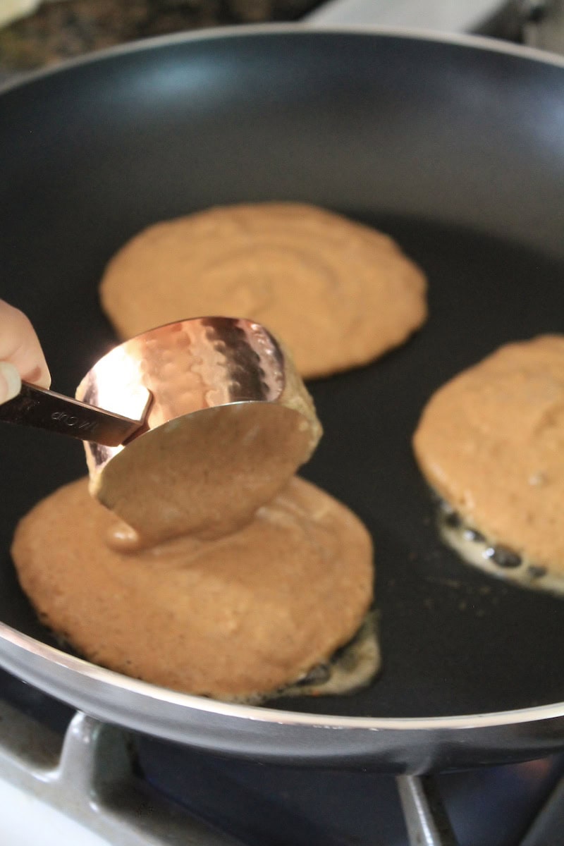 cook pumpkin protein pancakes in a hot buttered pan