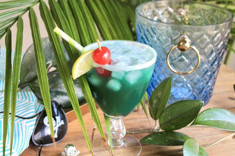 pineapple rum drink with blue curacao