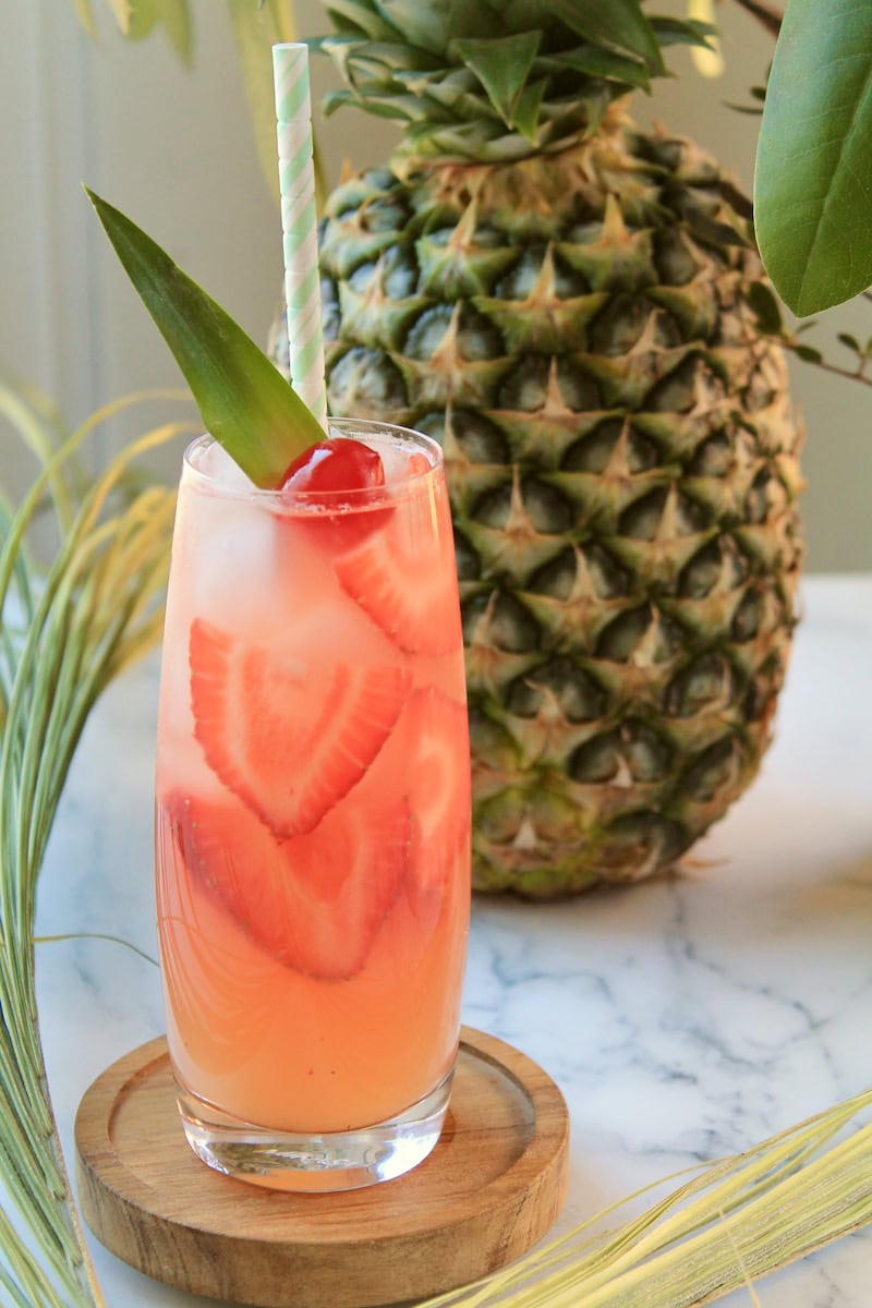 summer vodka cocktail with pineapple and cranberry