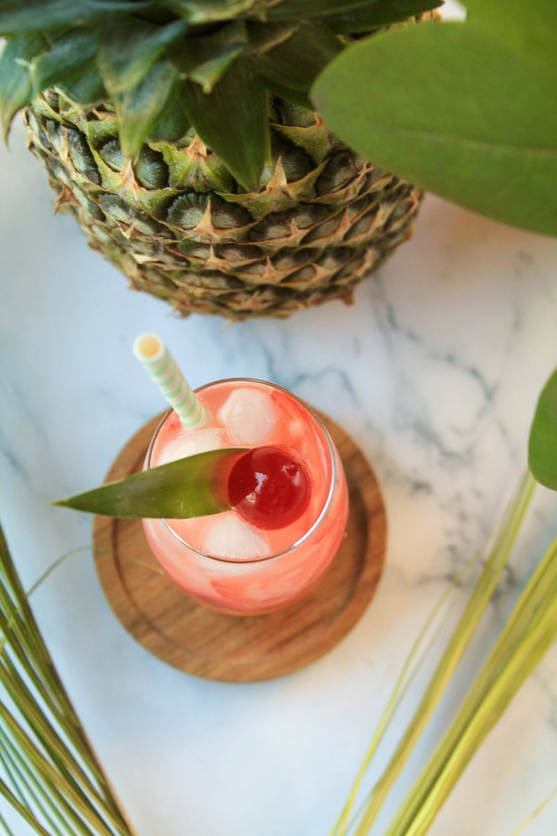 vodka drink with pineapple juice and fresh strawberry